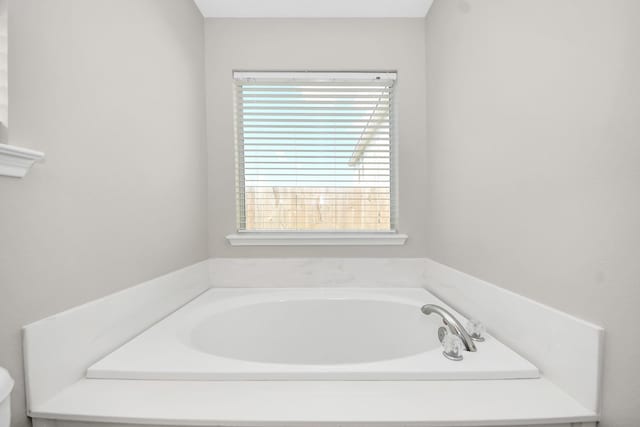 1805 Coronel St, Alvin, TX 77511 - full bathroom featuring healthy amount of natural light and a bath