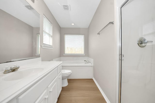 1805 Coronel St, Alvin, TX 77511 - full bath featuring toilet, a stall shower, vanity, wood finished floors, and a bath
