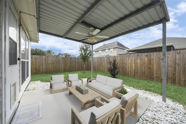 1805 Coronel St, Alvin, TX 77511 - fenced backyard featuring an outdoor living space, ceiling fan, and a patio
