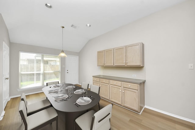 1805 Coronel St, Alvin, TX 77511 - dining room featuring light wood-type flooring, vaulted ceiling, baseboards, and recessed lighting
