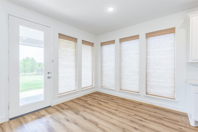 4131 Creek Shore Ln, Fulshear, TX 77441 - unfurnished sunroom with wood finished floors and recessed lighting
