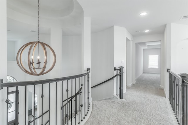 4131 Creek Shore Ln, Fulshear, TX 77441 - corridor with an upstairs landing, carpet floors, a chandelier, recessed lighting, and baseboards