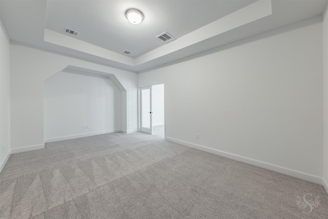 4131 Creek Shore Ln, Fulshear, TX 77441 - unfurnished room with a tray ceiling, carpet flooring, and baseboards