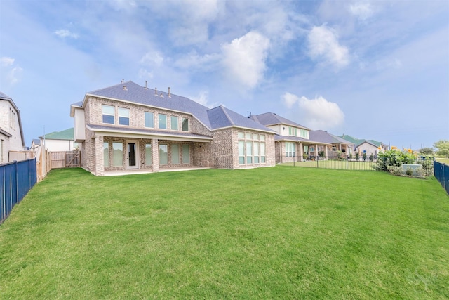 4131 Creek Shore Ln, Fulshear, TX 77441 - rear view of house featuring brick siding and a patio
