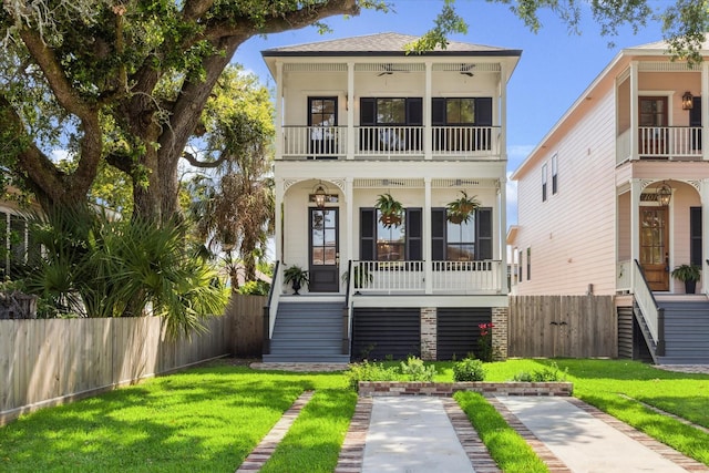 1514 31st St, Galveston, TX 77550 - beach home featuring a balcony, stairs, a porch, ceiling fan, and roof with shingles
