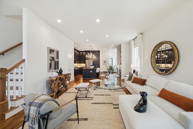 1514 31st St, Galveston, TX 77550 - living area featuring a chandelier, wood finished floors, stairway, and recessed lighting