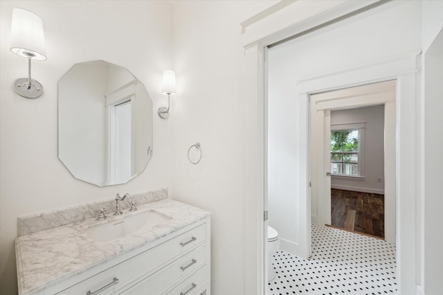 1514 31st St, Galveston, TX 77550 - bathroom with vanity, toilet, and baseboards