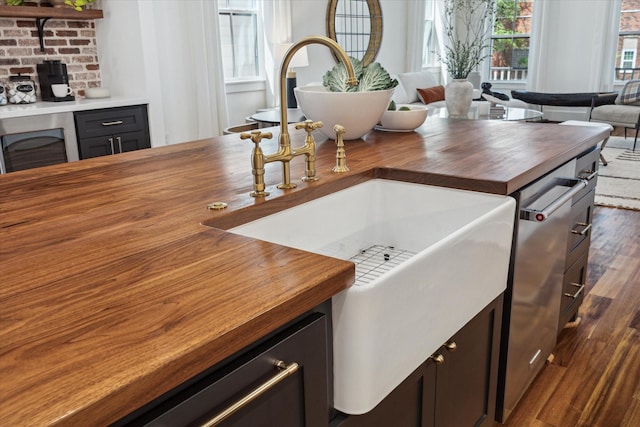 1514 31st St, Galveston, TX 77550 - kitchen with butcher block counters, dark wood-type flooring, a sink, open floor plan, and beverage cooler