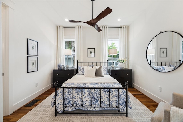1514 31st St, Galveston, TX 77550 - bedroom with baseboards, dark wood-style flooring, recessed lighting, and a ceiling fan