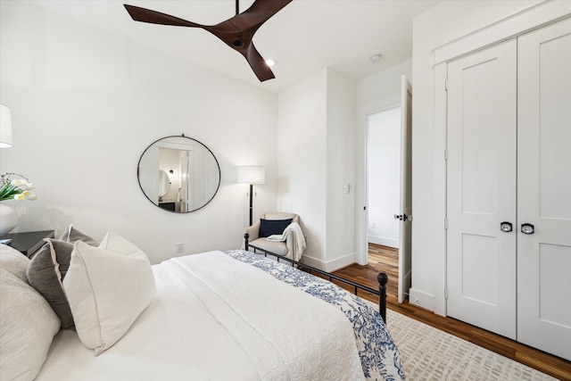 1514 31st St, Galveston, TX 77550 - bedroom featuring wood finished floors, a ceiling fan, baseboards, and a closet