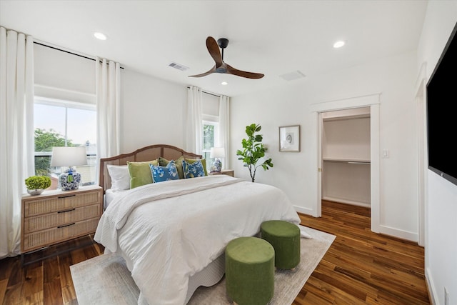1514 31st St, Galveston, TX 77550 - bedroom with dark wood finished floors, ceiling fan, a walk in closet, recessed lighting, and baseboards