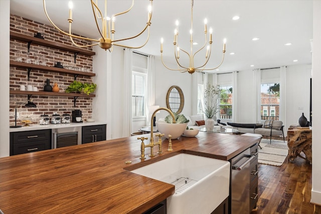 1514 31st St, Galveston, TX 77550 - kitchen featuring butcher block counters, a sink, wine cooler, recessed lighting, and dark wood-style floors