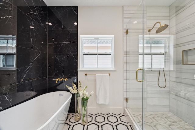 1514 31st St, Galveston, TX 77550 - full bathroom featuring a freestanding bath, a shower stall, and tile patterned floors