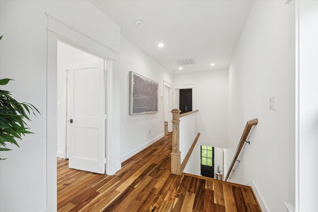 1514 31st St, Galveston, TX 77550 - corridor with an upstairs landing, wood finished floors, recessed lighting, and baseboards