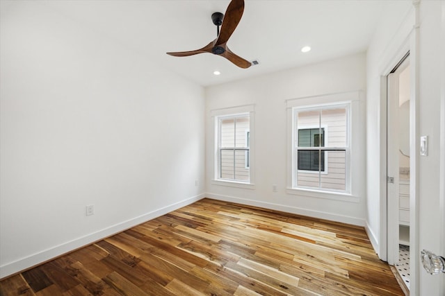 1514 31st St, Galveston, TX 77550 - empty room with wood finished floors, a ceiling fan, baseboards, and recessed lighting