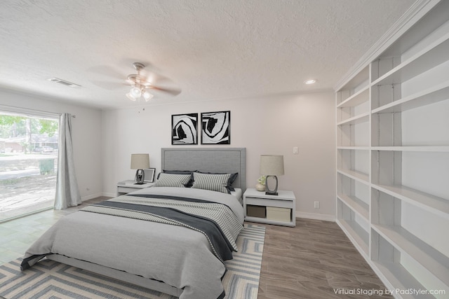5229 W 43rd St, Houston, TX 77092 - bedroom with a textured ceiling, wood finished floors, recessed lighting, ceiling fan, and baseboards