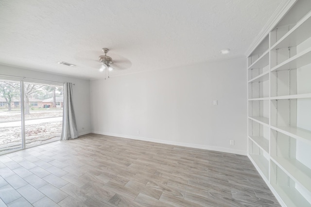 5229 W 43rd St, Houston, TX 77092 - empty room with ceiling fan, a textured ceiling, light wood-style floors, and baseboards