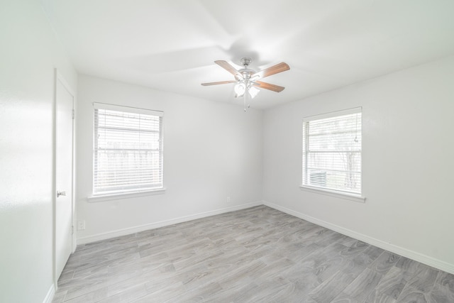 5229 W 43rd St, Houston, TX 77092 - spare room with ceiling fan, light wood-type flooring, and baseboards