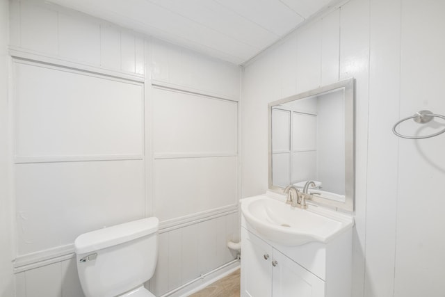 5229 W 43rd St, Houston, TX 77092 - bathroom featuring vanity, toilet, and a decorative wall