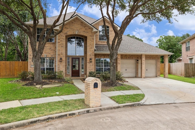 2119 Water Way, Seabrook, TX 77586 - traditional-style house with brick siding, roof with shingles, a garage, and concrete driveway