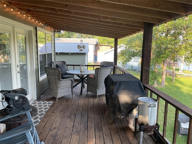 530 Sherwood Forest Dr W, Ivanhoe, TX 75979 - deck featuring outdoor dining area, a lawn, and grilling area