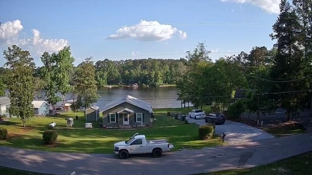 530 Sherwood Forest Dr W, Ivanhoe, TX 75979 - view of front of home with a front yard and a water view