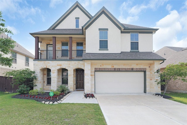 6026 Lake Bridge Ln, Manvel, TX 77578 - view of front of house featuring stone siding, a balcony, concrete driveway, and an attached garage
