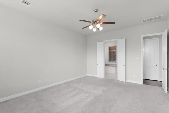 6026 Lake Bridge Ln, Manvel, TX 77578 - unfurnished bedroom with carpet, baseboards, ensuite bathroom, and ceiling fan