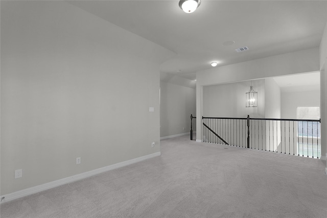 6026 Lake Bridge Ln, Manvel, TX 77578 - carpeted spare room featuring a chandelier and baseboards