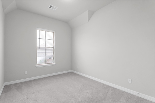 6026 Lake Bridge Ln, Manvel, TX 77578 - empty room with carpet flooring, lofted ceiling, and baseboards