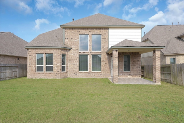 6026 Lake Bridge Ln, Manvel, TX 77578 - back of house featuring a patio area, brick siding, and roof with shingles