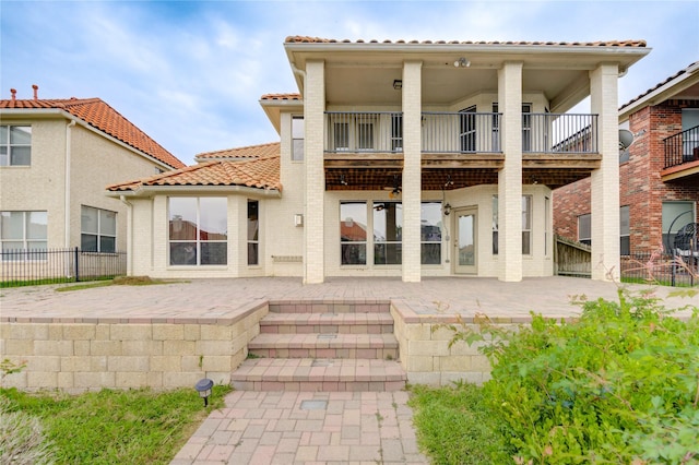 14330 Ayers Rock Rd, Sugar Land, TX 77498 - rear view of property with a balcony, a tile roof, and a patio area