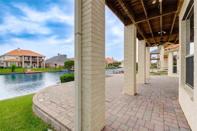 14330 Ayers Rock Rd, Sugar Land, TX 77498 - view of patio / terrace featuring a residential view, a water view, and a ceiling fan
