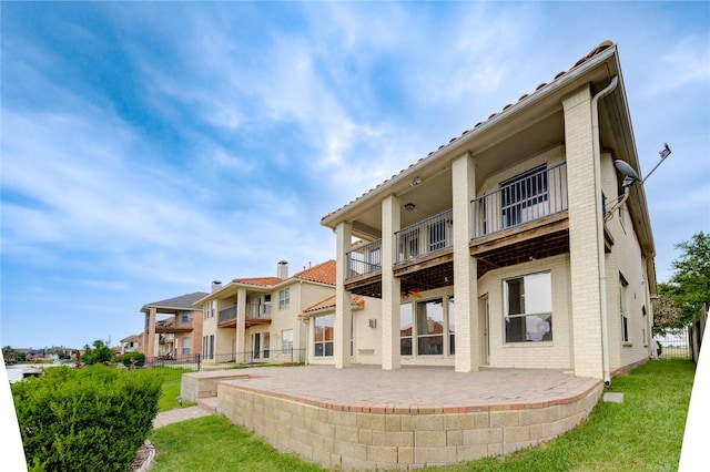 14330 Ayers Rock Rd, Sugar Land, TX 77498 - back of house with brick siding, a patio, and a balcony