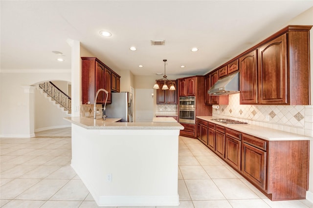 14330 Ayers Rock Rd, Sugar Land, TX 77498 - kitchen with under cabinet range hood, appliances with stainless steel finishes, light tile patterned floors, a peninsula, and backsplash