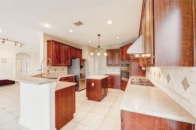 14330 Ayers Rock Rd, Sugar Land, TX 77498 - kitchen featuring stainless steel appliances, custom range hood, tasteful backsplash, a peninsula, and light tile patterned floors