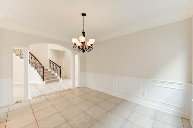 14330 Ayers Rock Rd, Sugar Land, TX 77498 - unfurnished room featuring light tile patterned floors, arched walkways, ornamental molding, stairway, and wainscoting