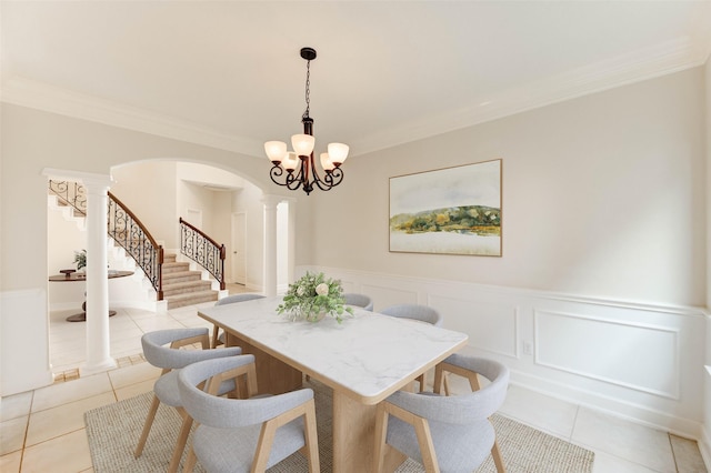 14330 Ayers Rock Rd, Sugar Land, TX 77498 - dining space with stairway, arched walkways, light tile patterned flooring, ornate columns, and ornamental molding
