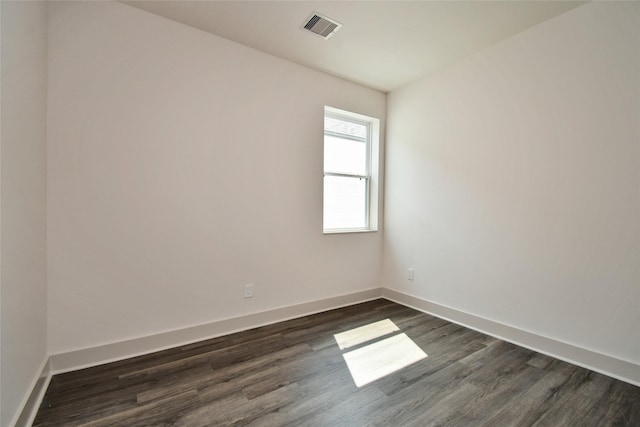 12808 Cozumel Ln, Houston, TX 77045 - spare room featuring dark wood-type flooring and baseboards