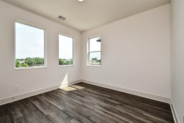 12808 Cozumel Ln, Houston, TX 77045 - spare room with healthy amount of natural light, baseboards, and dark wood finished floors
