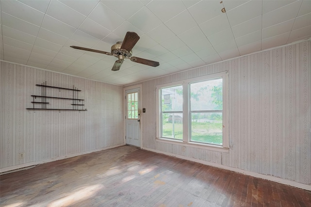 13326 Sundale Rd, Houston, TX 77038 - empty room featuring hardwood / wood-style flooring, a ceiling fan, baseboards, and wallpapered walls