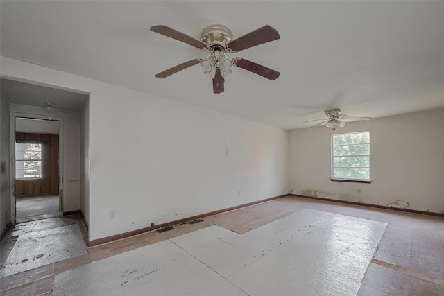 13326 Sundale Rd, Houston, TX 77038 - unfurnished room featuring plenty of natural light, ceiling fan, and baseboards