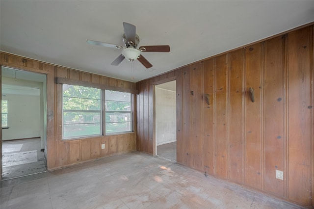 13326 Sundale Rd, Houston, TX 77038 - unfurnished room featuring wooden walls, a ceiling fan, and baseboards