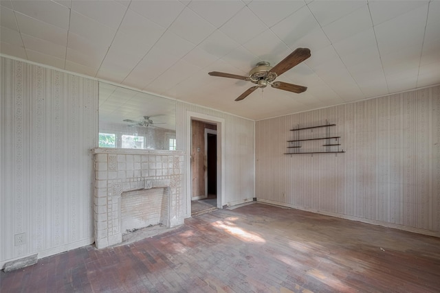 13326 Sundale Rd, Houston, TX 77038 - unfurnished living room with hardwood / wood-style floors, ceiling fan, a fireplace, and wallpapered walls