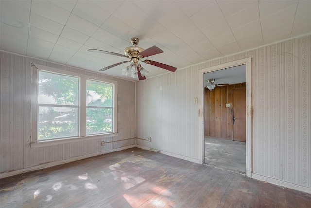 13326 Sundale Rd, Houston, TX 77038 - unfurnished room featuring wood-type flooring, ceiling fan, and wallpapered walls