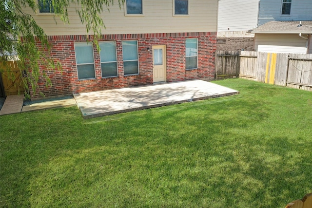 19326 Camellia Knoll Trl, Houston, TX 77084 - back of house with a patio and brick siding