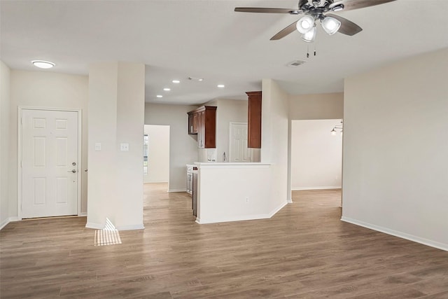 19326 Camellia Knoll Trl, Houston, TX 77084 - unfurnished living room with a ceiling fan, baseboards, wood finished floors, and recessed lighting
