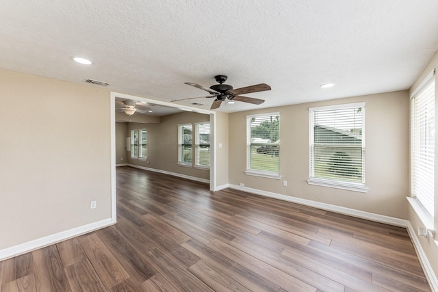 280 Crestmont St, Point Blank, TX 77364 - empty room featuring a ceiling fan, baseboards, a textured ceiling, dark wood-type flooring, and recessed lighting
