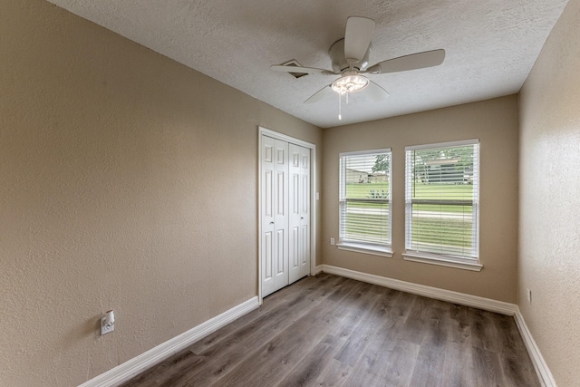 280 Crestmont St, Point Blank, TX 77364 - unfurnished room featuring wood finished floors, baseboards, a ceiling fan, a textured ceiling, and a textured wall