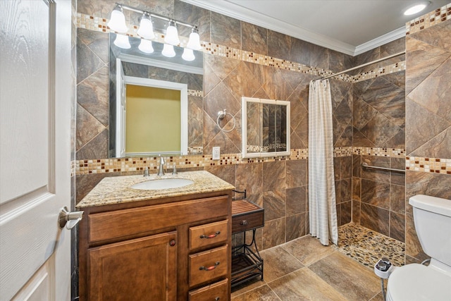 7506 Dearborn St, Houston, TX 77055 - full bathroom featuring ornamental molding, toilet, tile walls, a tile shower, and vanity